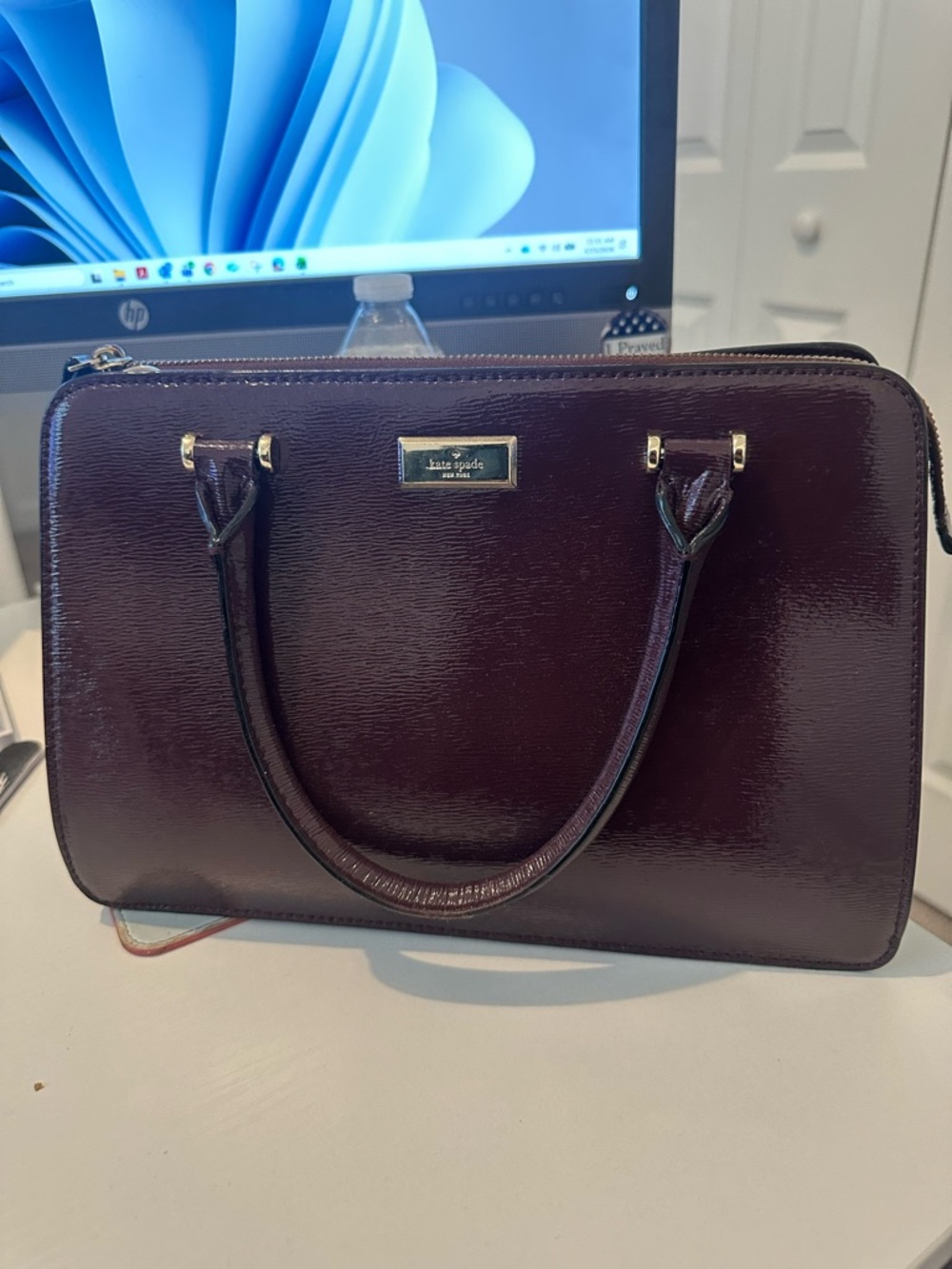 Kate Spade glossy patent leather satchel in deep burgundy